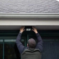 Integrated LED Black Motion-Sensing Compact Standard Light by Westek -Outlet OttLite Store black westek wall pack lights bl smsl 1d 1000