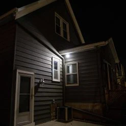 Integrated LED Black Motion-Sensing Compact Standard Light by Westek -Outlet OttLite Store black westek wall pack lights bl smsl 76 1000